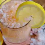 Pink Salt Trick for Weight Loss: 9 Proven Facts You Must Know 9 Glass of pink Himalayan salt water with lemon slice — part of the pink salt trick for weight loss morning drink.